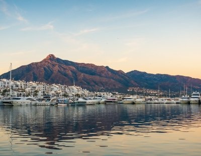 Marbella marina with yachts and mountains behind