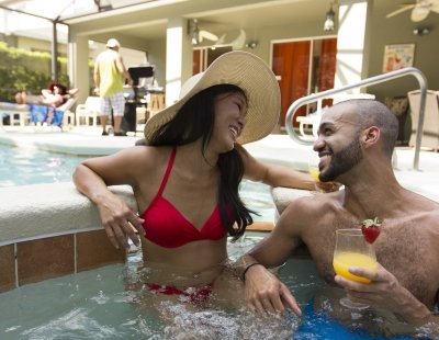 Couple in villa private pool, Orlando, Florida