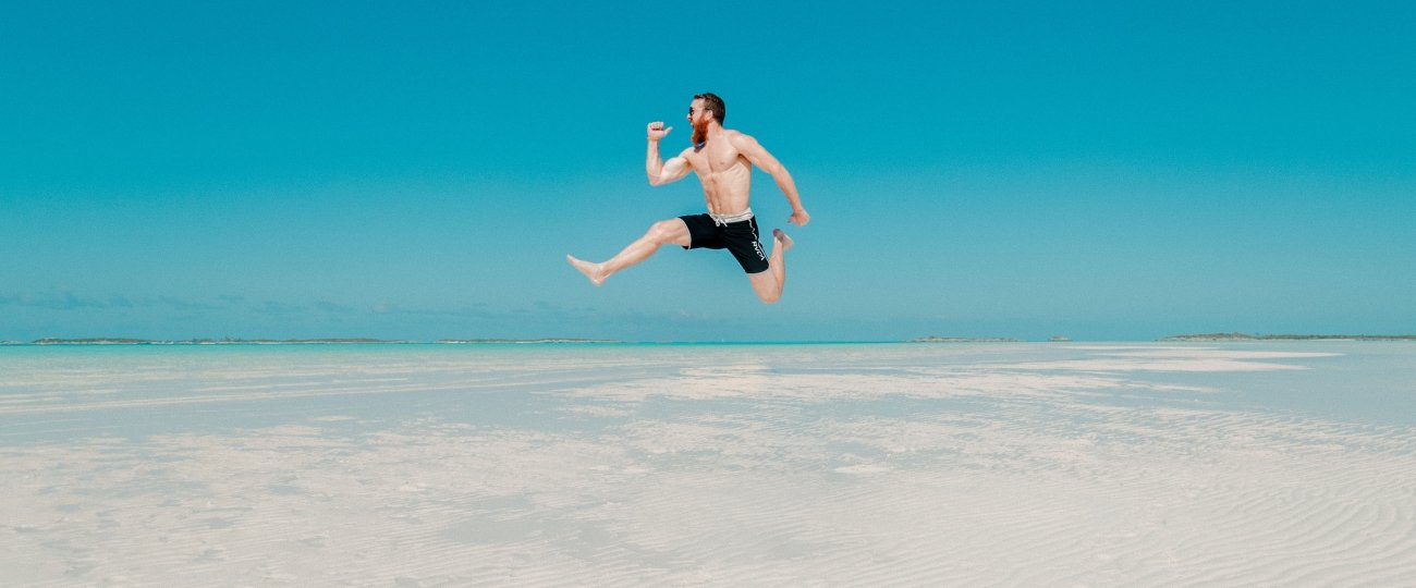 man jumping on beach villa  holiday