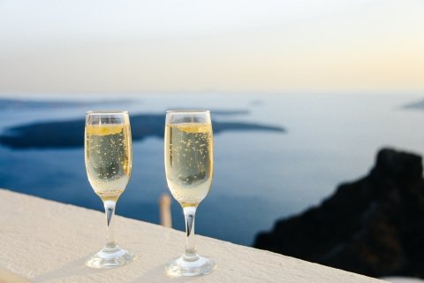 Champagne glasses overlooking the sea