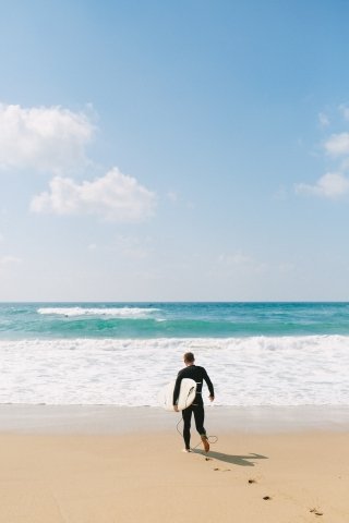 Man surfing in Sagres, Algarve