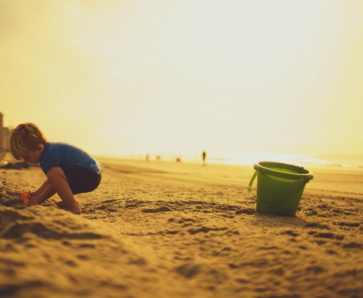 Child on sandy beach
