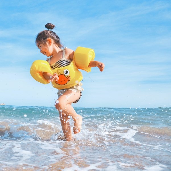 Child paddling in sea
