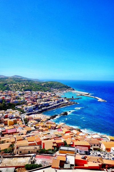 Terracotta roofs and Sardinia coastline