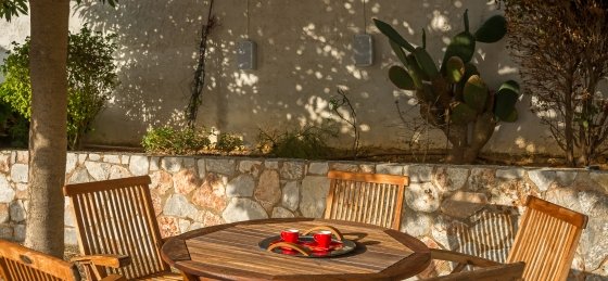 sitting_on_the_courtyard.jpg Villas in Greece